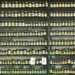 assorted labeled bottle on display shelf